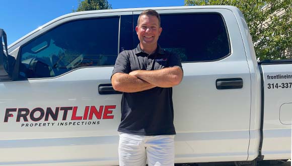Todd Mayer, licensed home inspector near St Louis, standing in front of the Frontline Property Inspections truck.